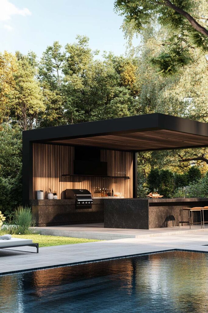 Luxury outdoor grill station with dark stone counters, wood paneling, covered roof, and poolside setting