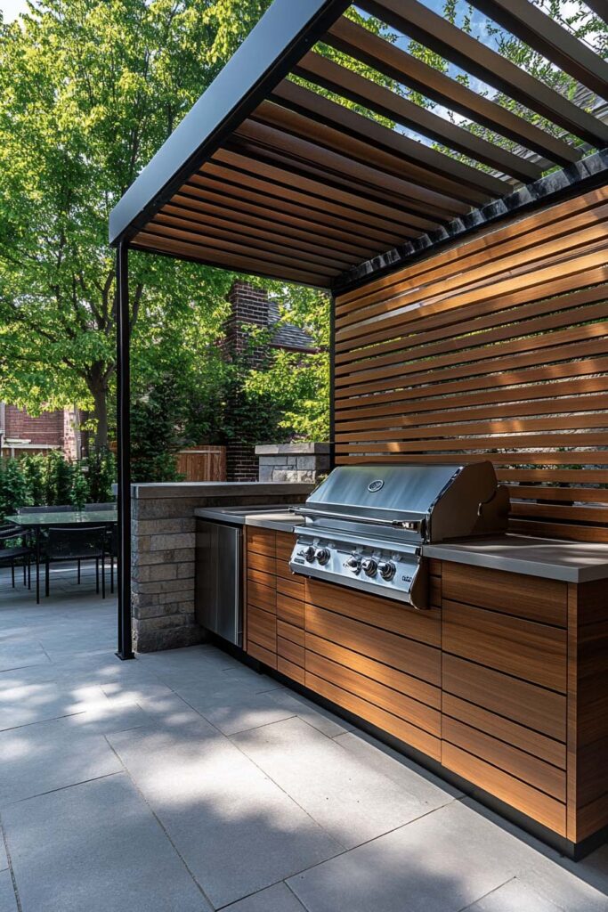 Outdoor grill station with wood cabinetry, built-in grill, slatted pergola roof, and modern patio design.