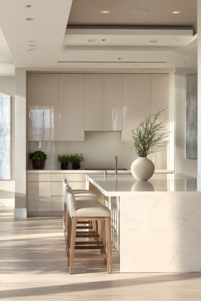 Modern neutral kitchen with stone island, minimalist cabinetry, and subtle dimensional surfaces creating depth in textured kitchen design.