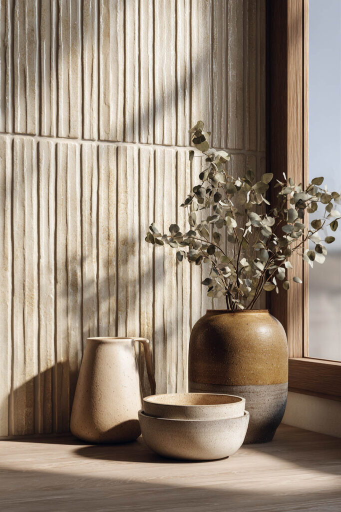 Fluted tile backsplash with ribbed texture and warm neutral styling in a dimensional surfaces kitchen design